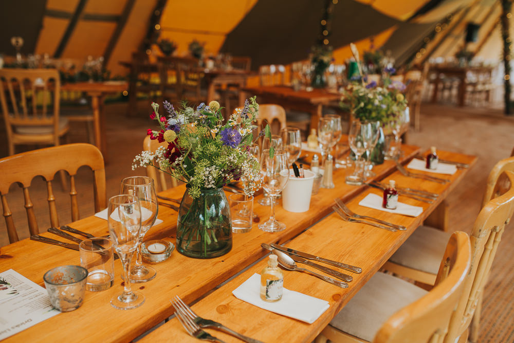 Long Rustic Wooden Tables Vase Flowers Decor Sussex Tipi Wedding Charlotte Razzell Photography