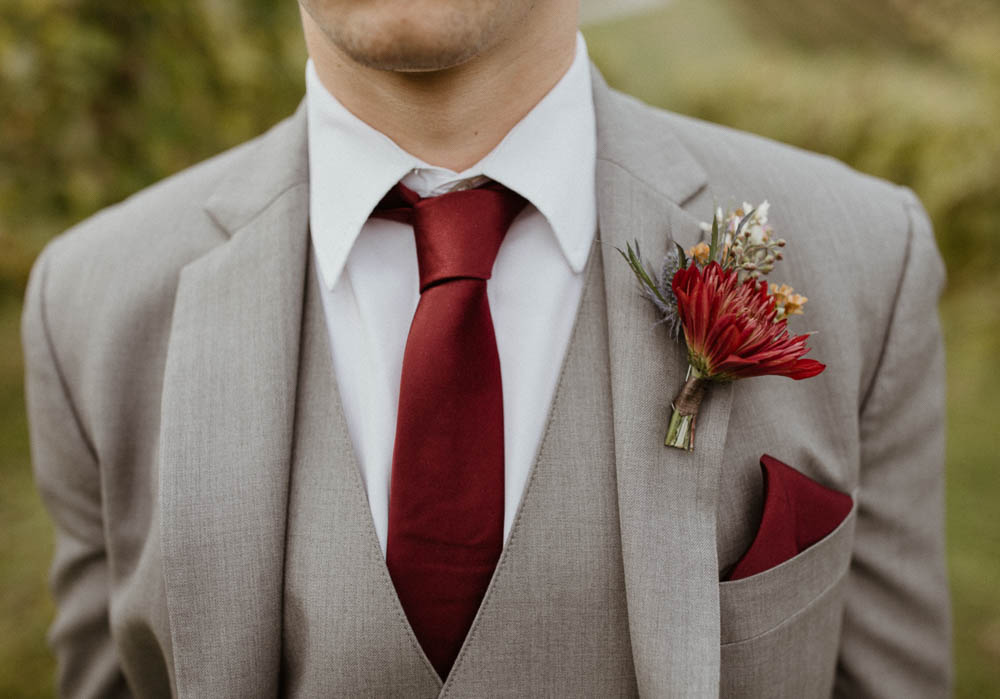 Red Buttonhole Flowers Groom CeNita Vineyards Wedding Kate Hensley Phillips Photography