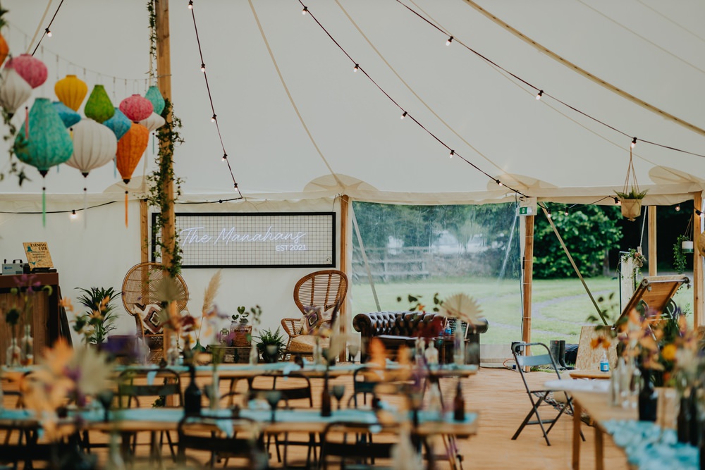 Cheswell Grange Wedding James Merrick Photography Colourful Marquee Lanterns Neon Signs Wooden Tables Industrial
