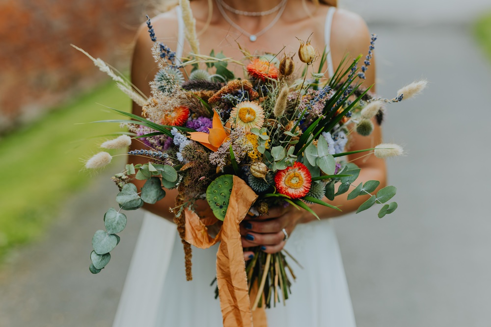 Bouquet Flowers Bride Bridal Orange Greenery Grass Cheswell Grange Wedding James Merrick Photography