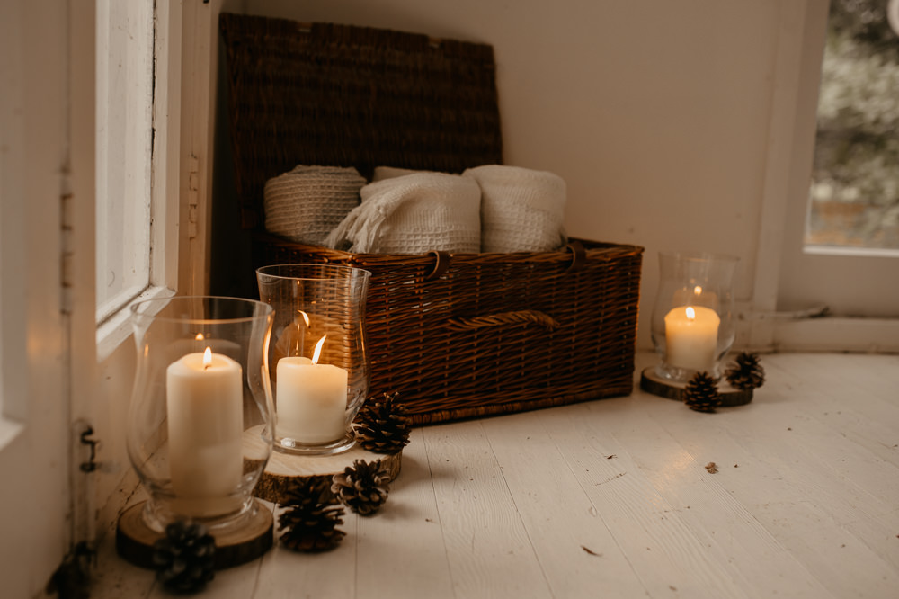Hurrican Lamp Candles Log Slice Pine Cone Decor December Wedding Ideas Megan Donati Photography