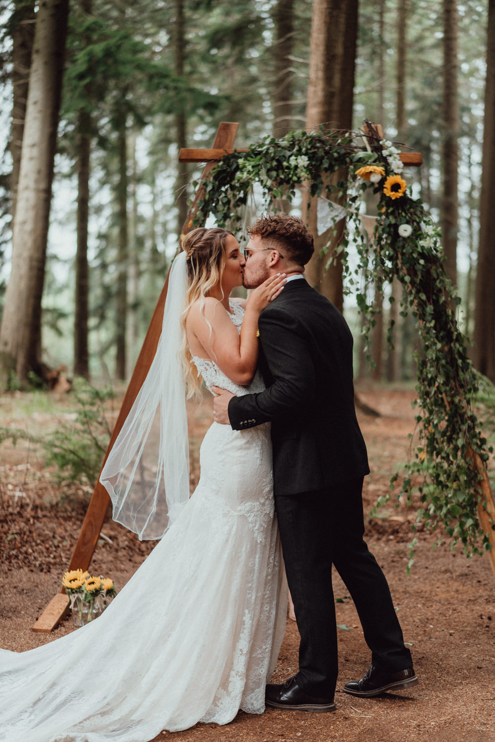Hampshire Woodland Wedding Emily & Steve Wooden Arch Ceremony Backdrop Greenery Sunflower