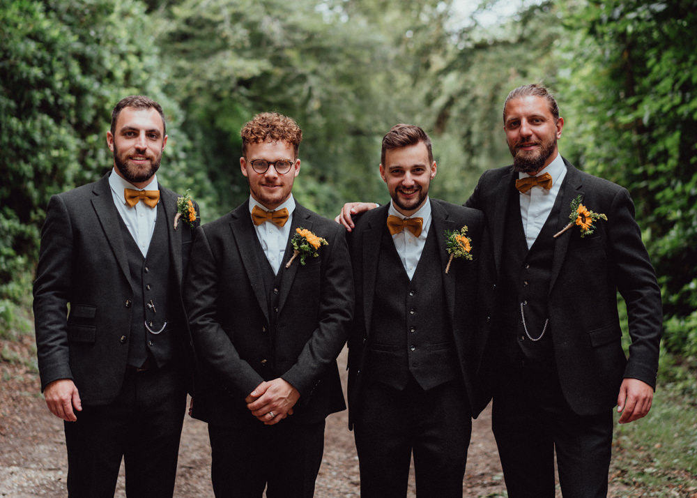 Groom Black Suit Mustard Yellow Bow Tie Sunflower Buttonhole Groomsmen Hampshire Woodland Wedding Emily & Steve