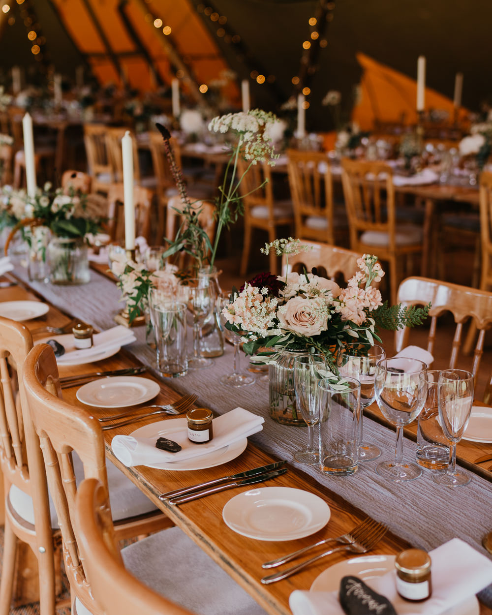 Tipi Decor Long Wooden Tables Greenery Candles Flowers Hertfordshire Farm Wedding Jonny Gouldstone Photography