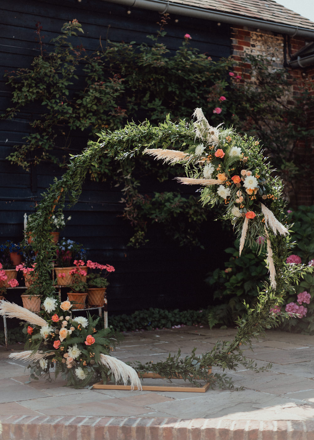 South Downs Barn Wedding Emily Steve Moongate Flower Arch Backdrop Greenery Pampas Grass