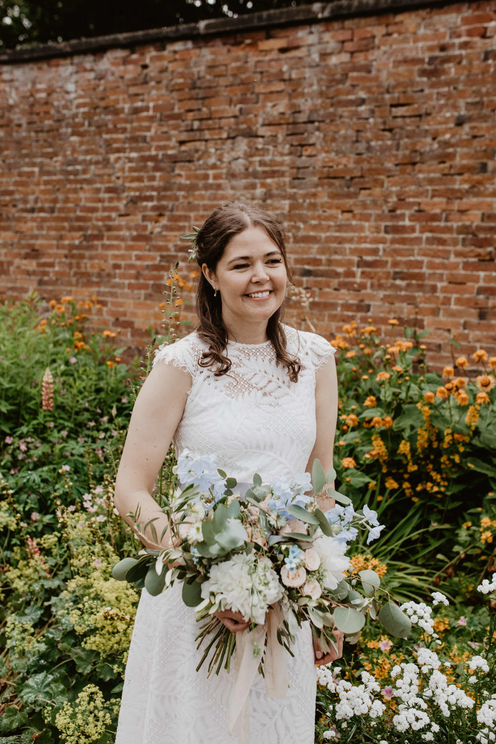 Dress Gown Lace Ribbon Sash Bouquet Flowers Bride Bridal Blue Peach Rose Greenery Bride Bridal Thorpe Garden Wedding Camilla Andrea Photography