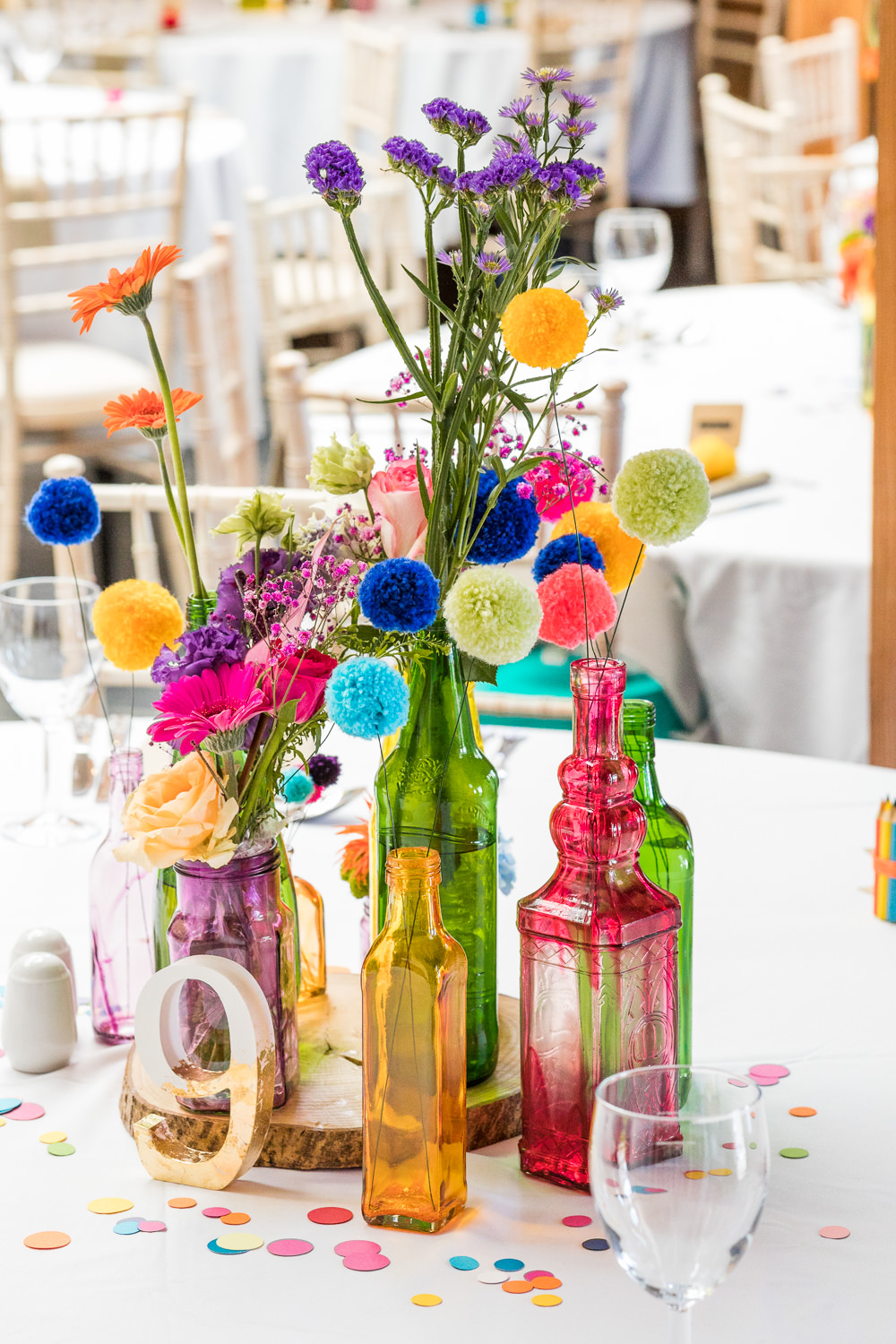Centrepiece Decor Flowers Wool Pom Poms Rainbow Woodhouse Barn Wedding John Wellings