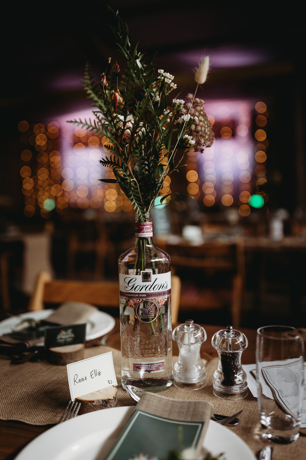 Wooden Table Decor Rustic Hessian Flowers Gin Bottles Barn Norfolk Wedding Thyme Lane Photography