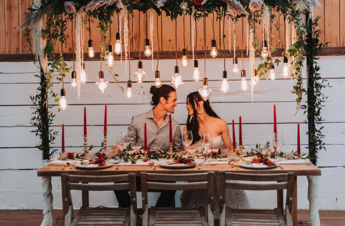 Festoon Lighting Wooden Table Red Candles Napkins Greenery Decor Bold Wedding Ideas Pasha Jansen Photography