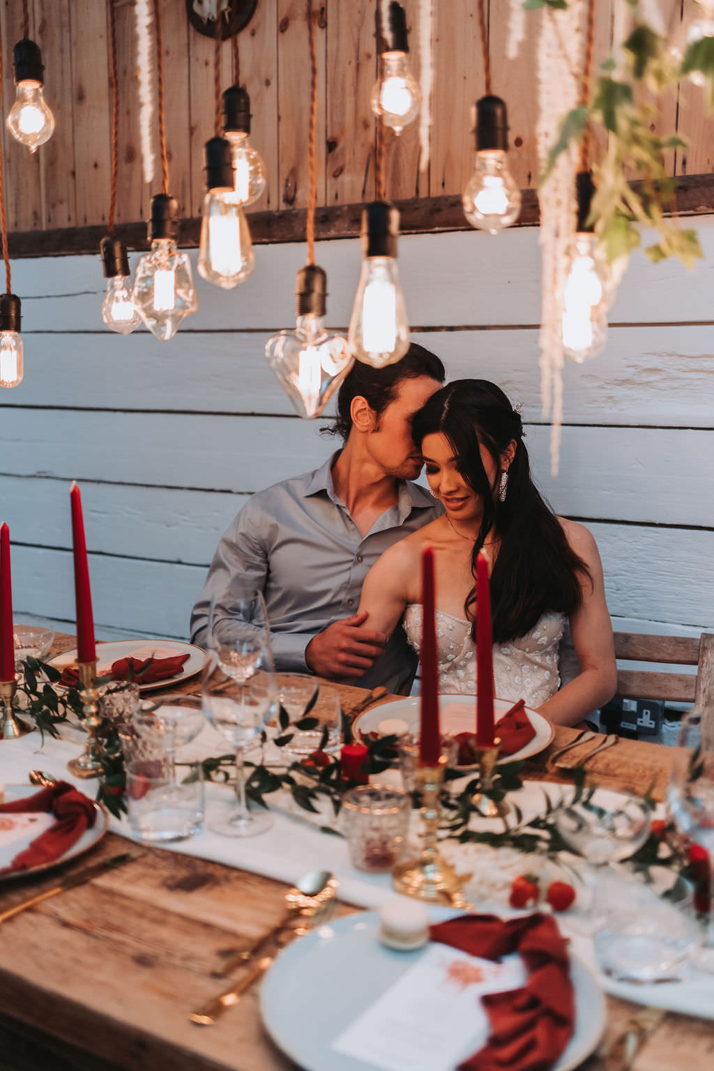 Festoon Lighting Wooden Table Red Candles Napkins Greenery Decor Bold Wedding Ideas Pasha Jansen Photography