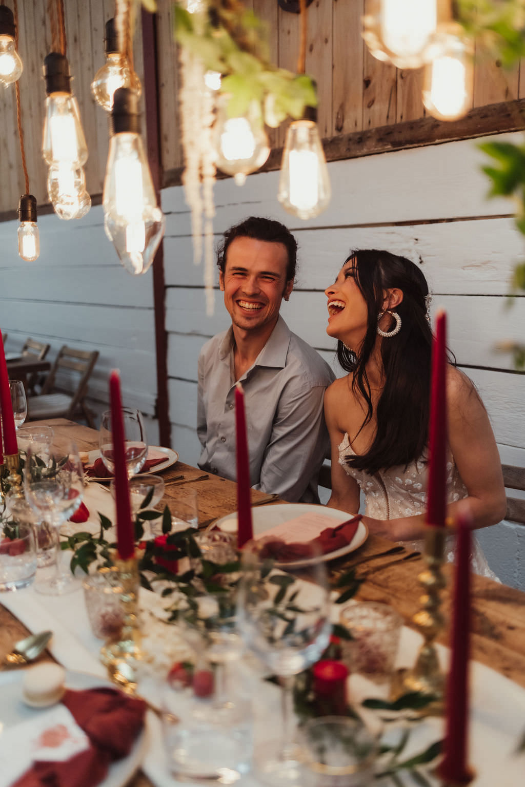 Festoon Lighting Wooden Table Red Candles Napkins Greenery Decor Bold Wedding Ideas Pasha Jansen Photography