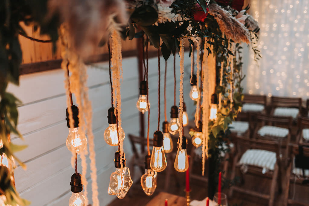 Festoon Lighting Wooden Table Red Candles Napkins Greenery Decor Bold Wedding Ideas Pasha Jansen Photography