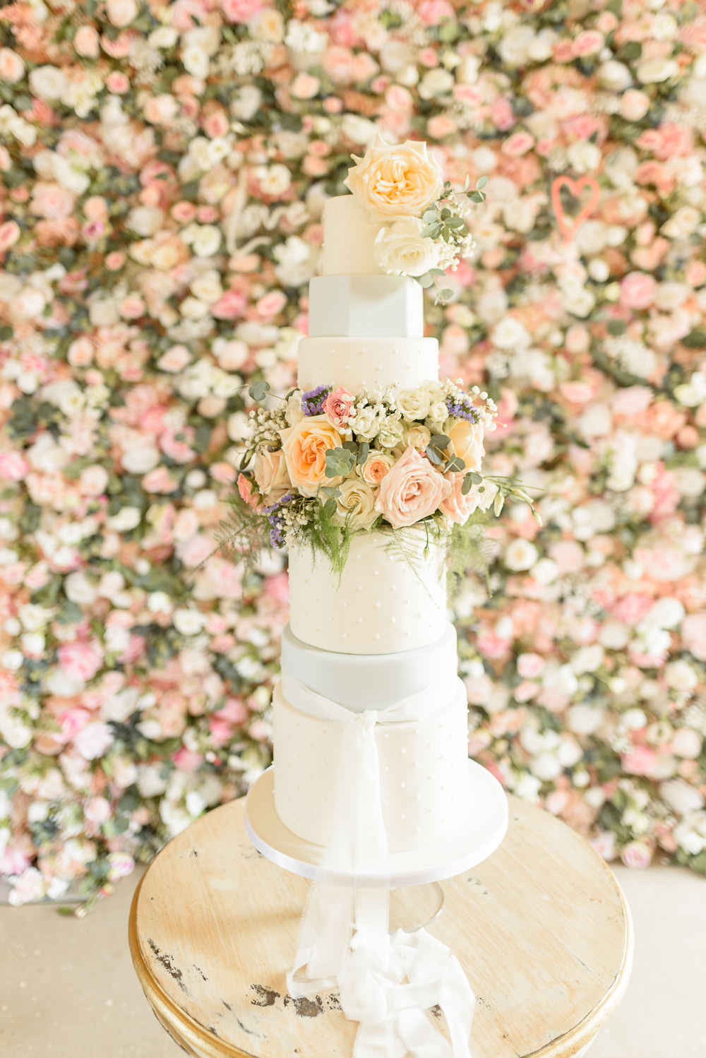 Tall Cake Iced Flowers Floral Flower Wall Backdrop Burlton Manor Wedding Tanya Flannagan Photography