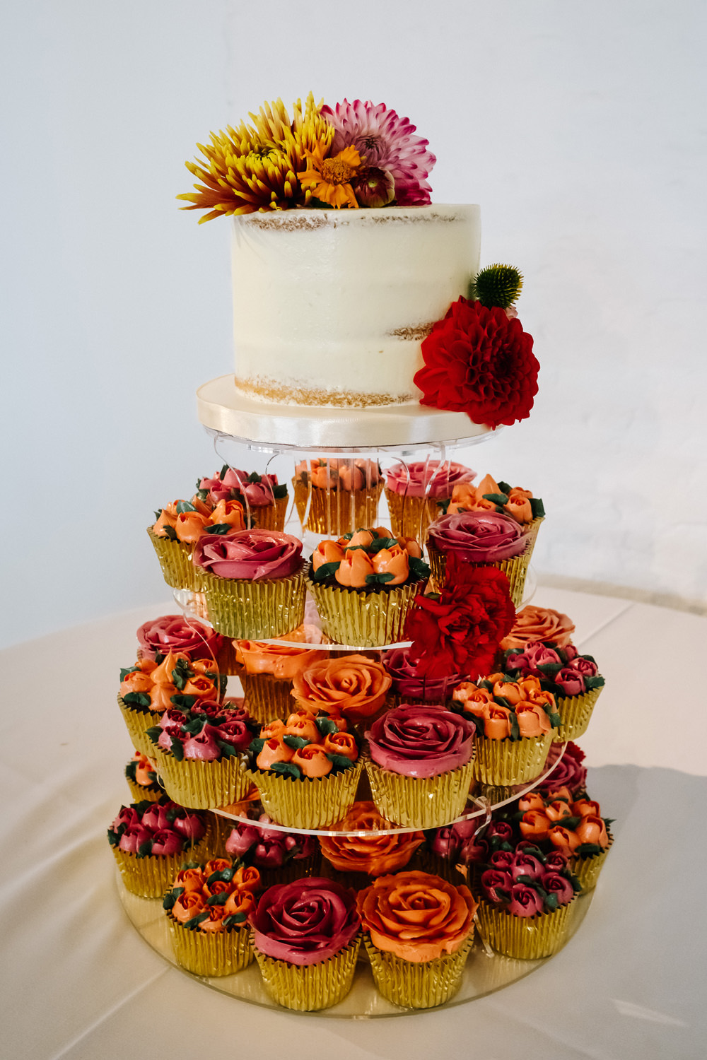 Colourful Cake Tower Cupcakes Flowers Red Orange London Warehouse Wedding Kristian Leven Photography