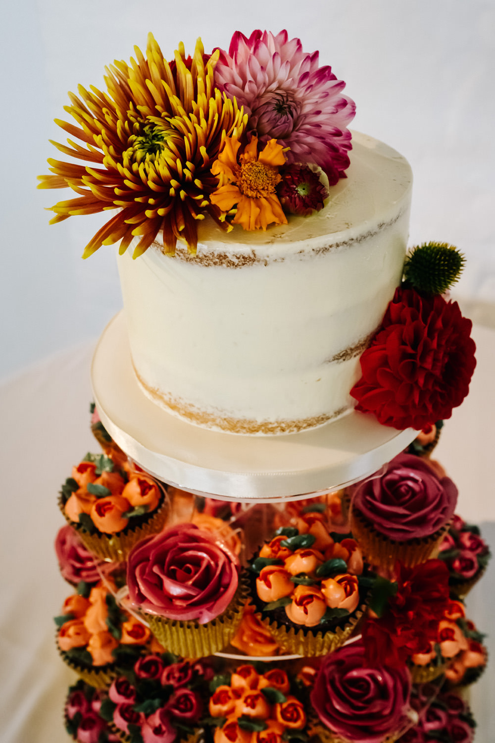 Colourful Cake Tower Cupcakes Flowers Red Orange London Warehouse Wedding Kristian Leven Photography