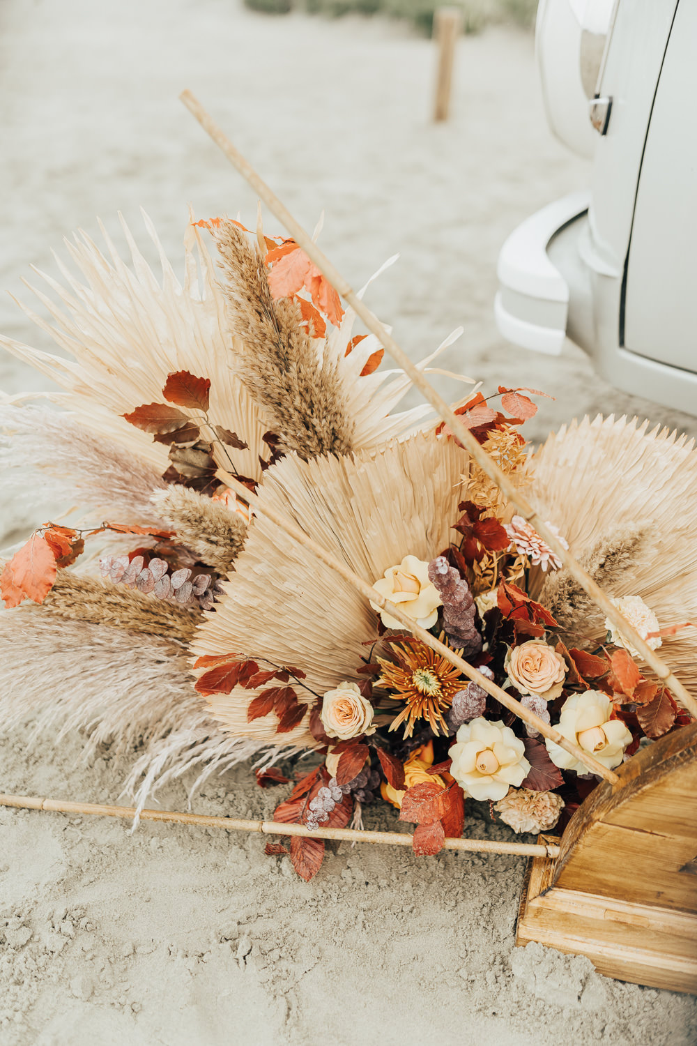 Flower Arrangement Orange Rose Palm Leaf Boho Beach Elopement Rebecca Carpenter Photography