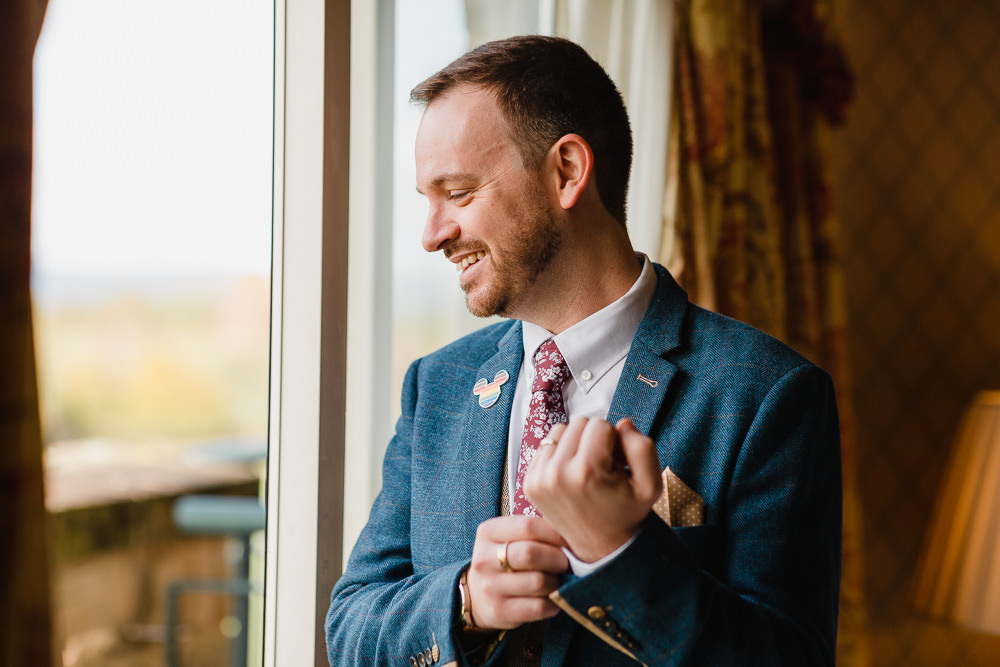 Celtic Manor Resort Wedding Michelle Huggleston Photography Groom Suit Navy Waistcoat Floral Tie Pin Badge