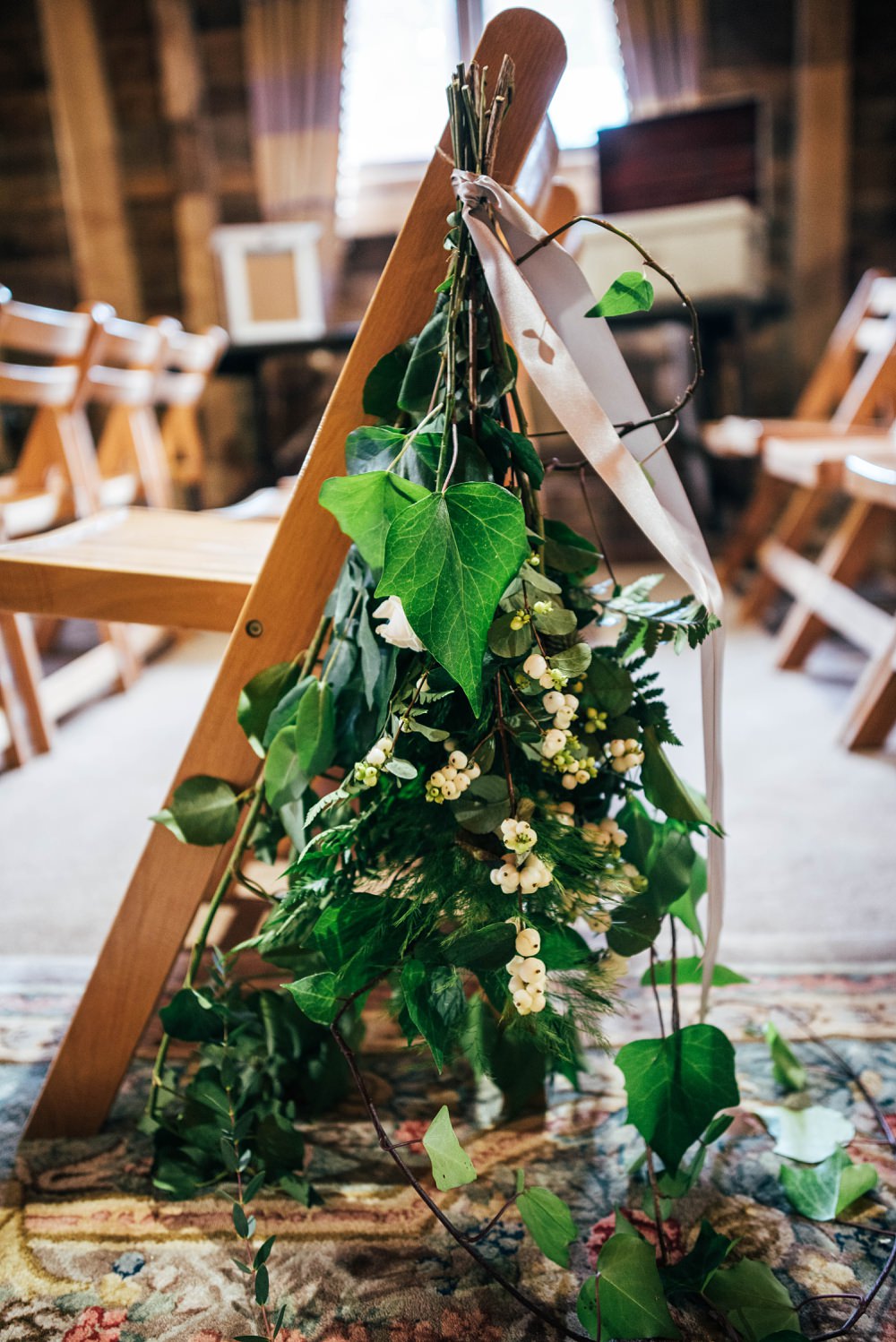 Pew End Aisle Flowers Greenery Little Tey Barn Wedding Three Flowers Photography