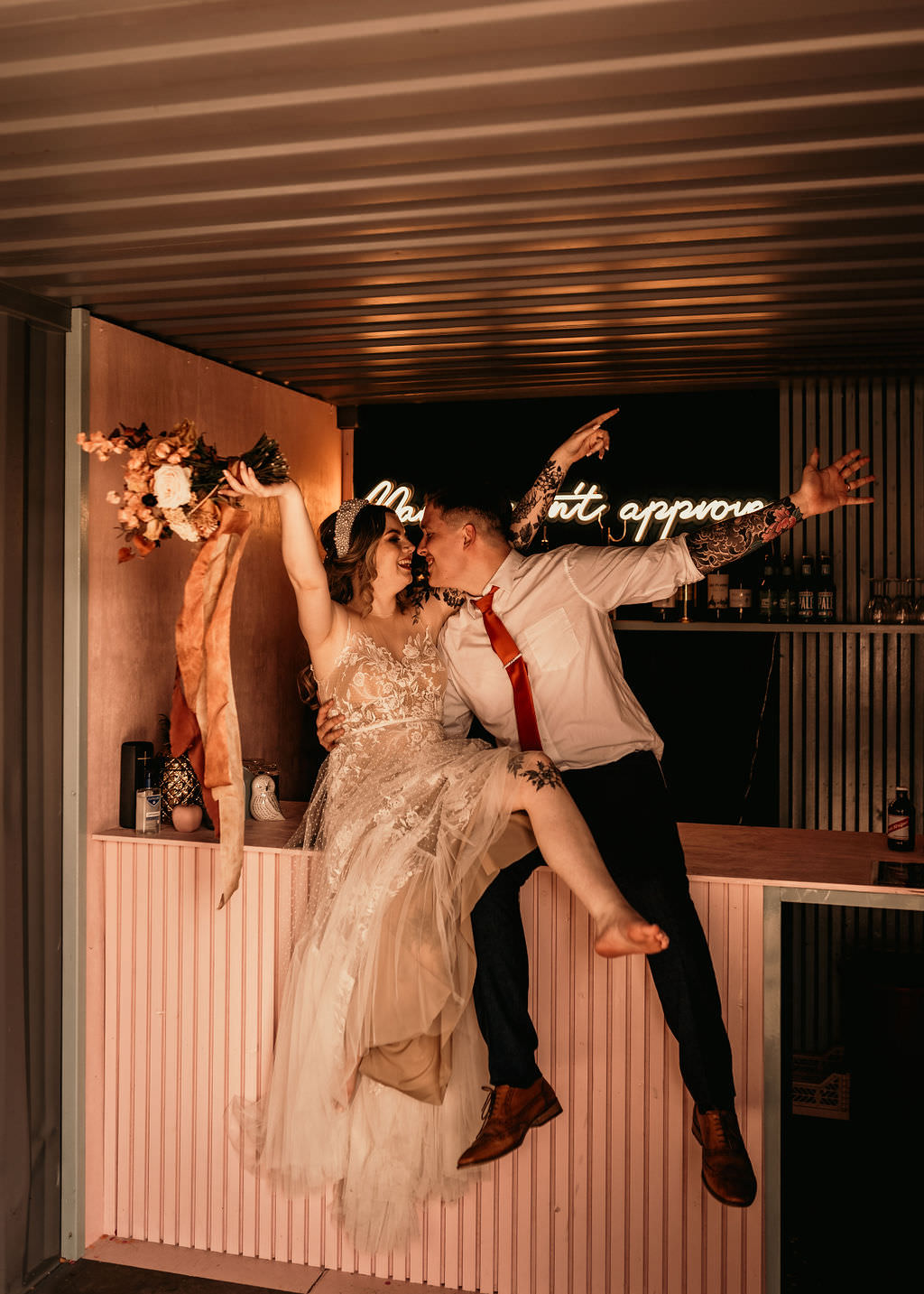 Newly Wed Couple Cheering Beer Garden Wedding Photos By Hash
