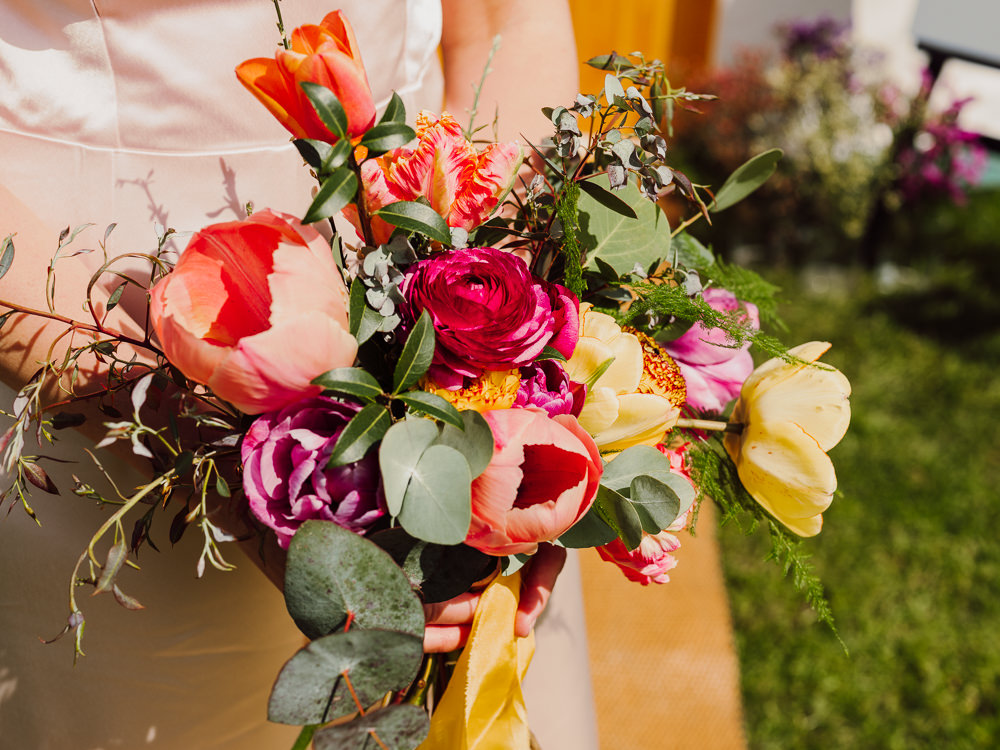 Bouquet Flowers Bride Bridal Spring Tulip Orange Yellow Pink Festival Yurt Wedding Scott Carney Photography