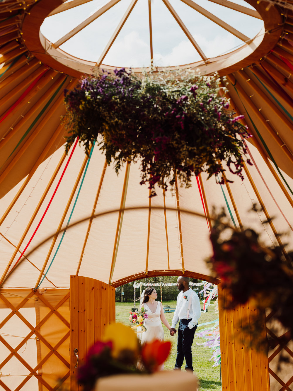 Hanging Flower Arrangement Rainbow Festival Yurt Wedding Scott Carney Photography