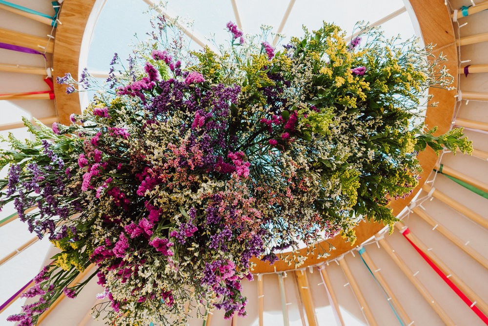 Hanging Flower Arrangement Rainbow Festival Yurt Wedding Scott Carney Photography