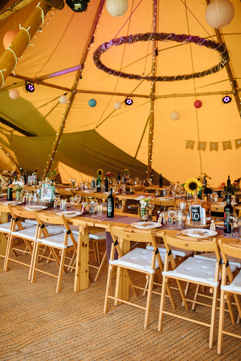 Tipi Reception Decor Lanterns Bunting Long Wooden Tables Lynsted Park Wedding Laura Debourde Photography