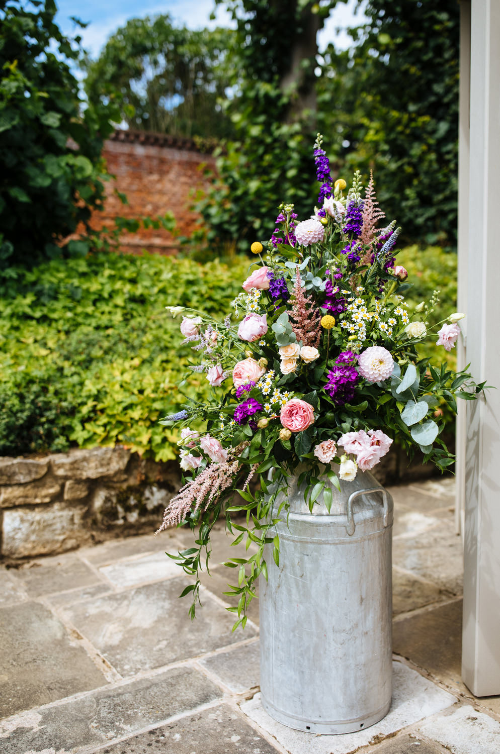 Flower Arrangement Coral Rose Stocks Fresia Dahlia Milk Churn Lynsted Park Wedding Laura Debourde Photography