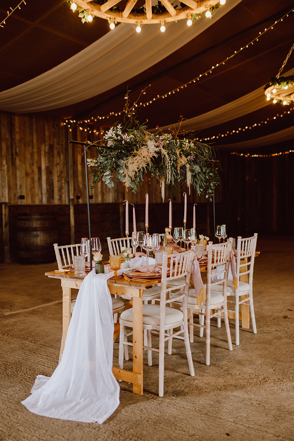 Wooden Table Pink Candles Decor Suspended Flowers Greenery Fairy Lights Montague Farm Wedding Jessica Bevan Photography