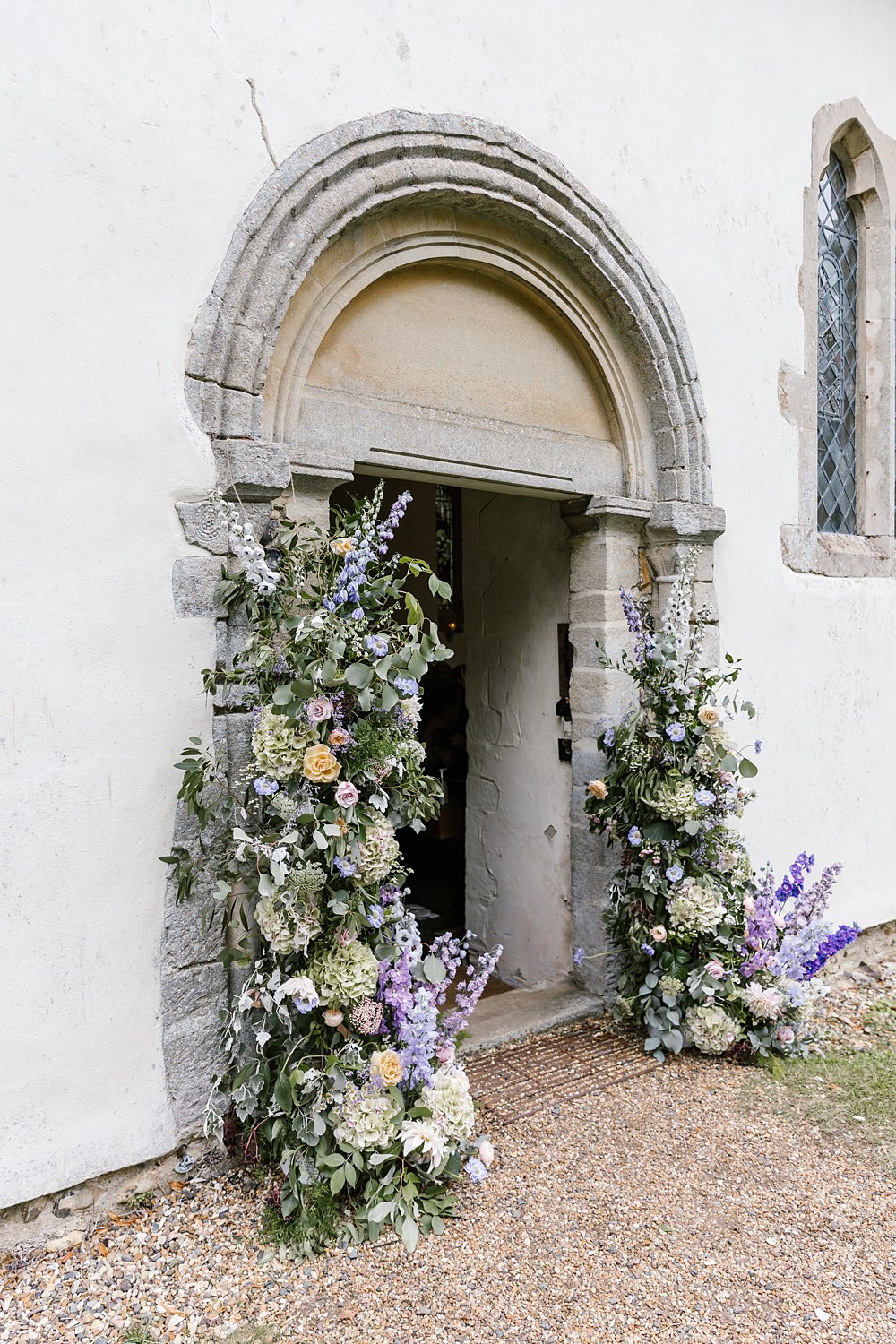 Church Door Flower Installation Lilac Pink Delphinium Hydrangea Barnston Lodge Wedding Katherine Ashdown Photography