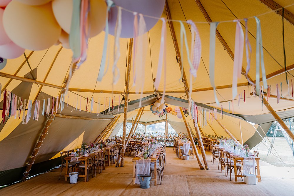Rag Bunting Tipi Balloon Decor Bottle Flowers Long Tables Barnston Lodge Wedding Katherine Ashdown Photography