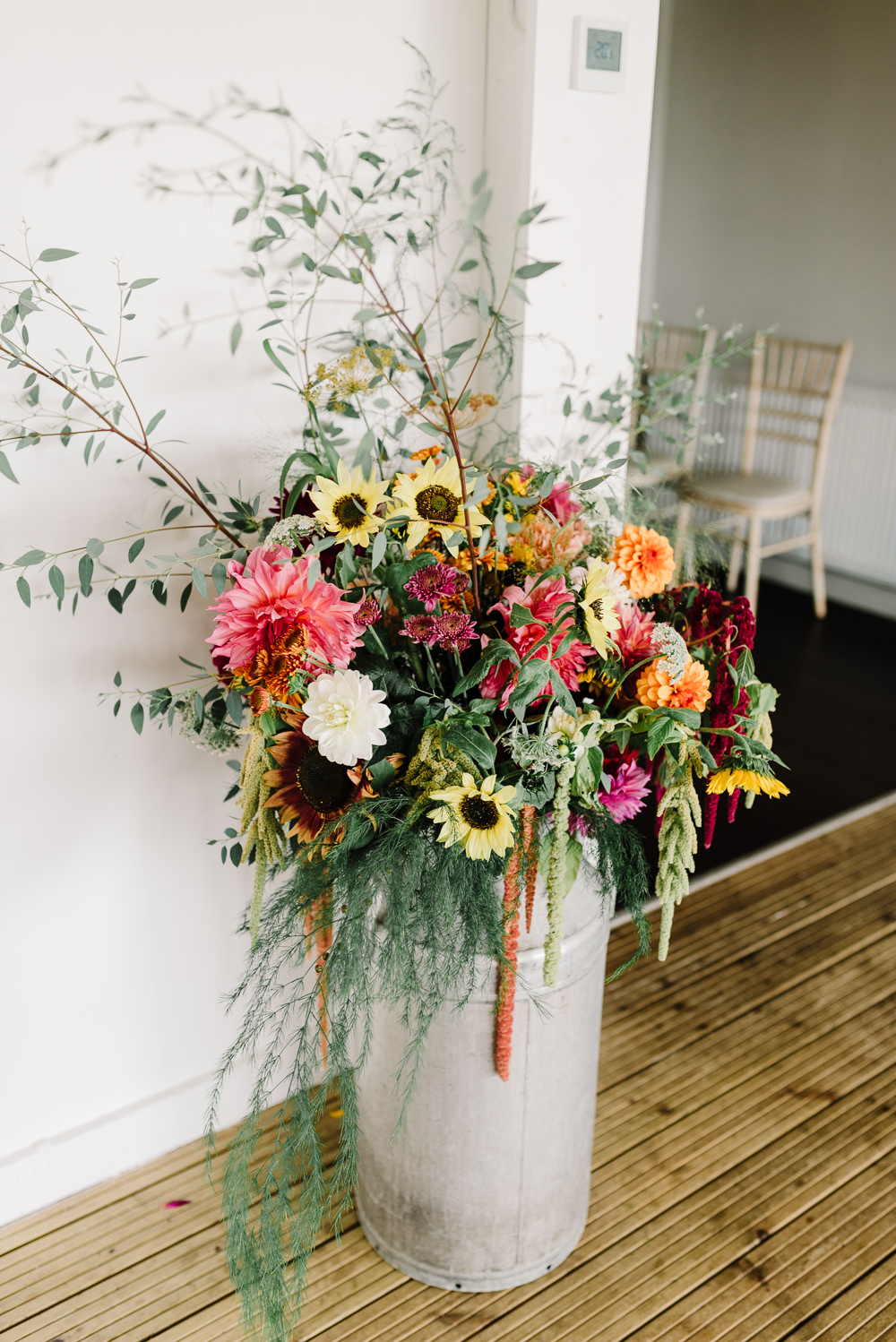Colourful Wildflowers Autumn Sunflower Dahlia Greenery Amaranthus Milk Urn Bashall Barn Wedding Rachel Kenyon Photography