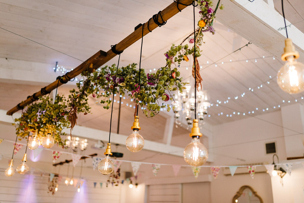 Rustic Hanging Lights Flowers Wedding Decoration Festoon Lighting Bashall Barn Wedding Rachel Kenyon Photography