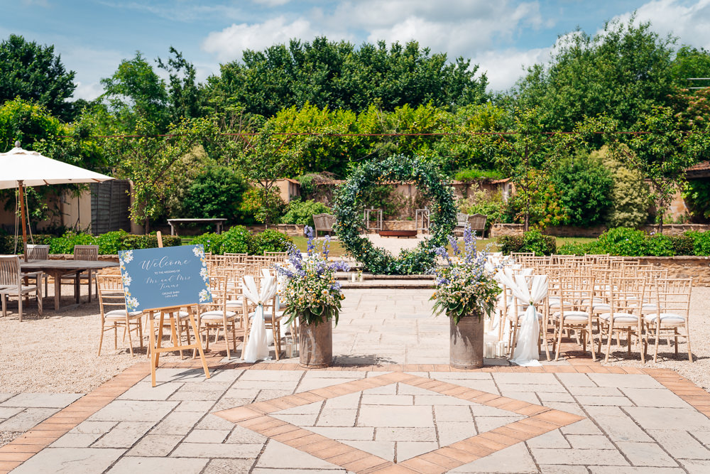 Greenery Hoop Moon Gate Greenery Flower Arch Ceremony Blue Yellow Wedding Ideas EmilyCollettPhotography