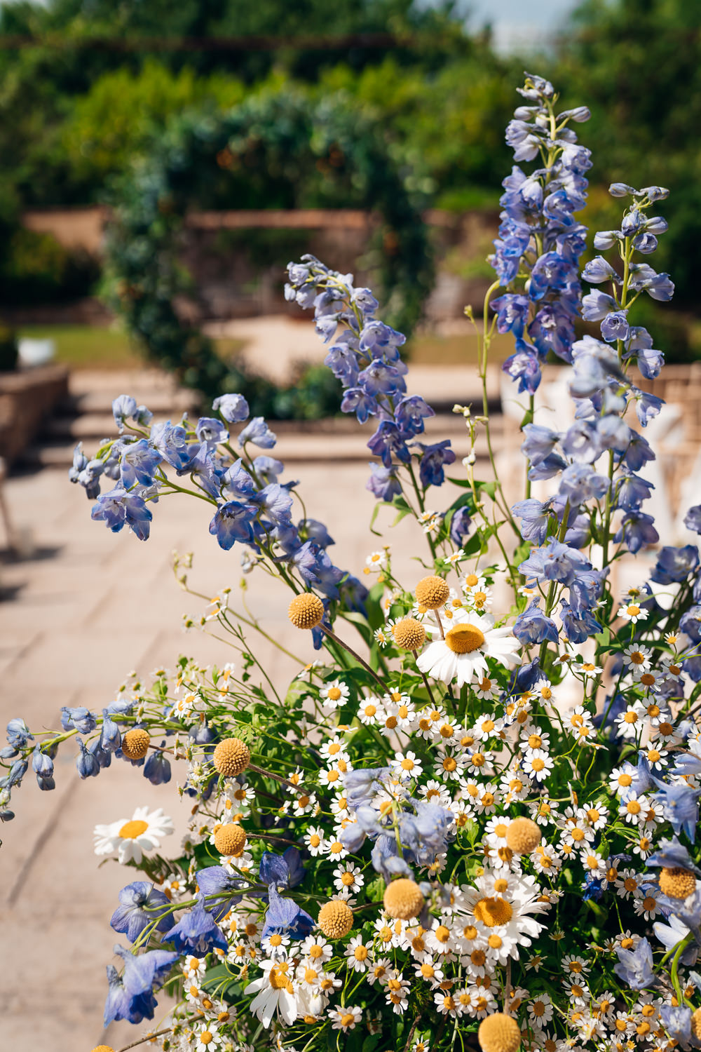 Craspedia Daisies Delphiniums Flower Arrangement Ceremony Blue Yellow Wedding Ideas EmilyCollettPhotography