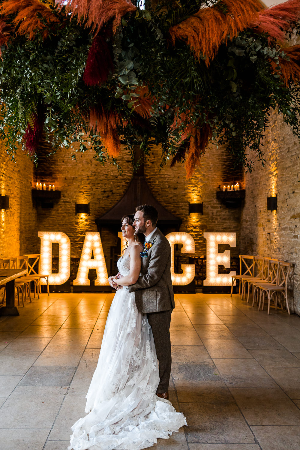 Pampas Grass Hoop Orange Pink Hanging Floral Display Greenery Dance Light Up Letters Colourful Wildflower Wedding Eve Dunlop Photography