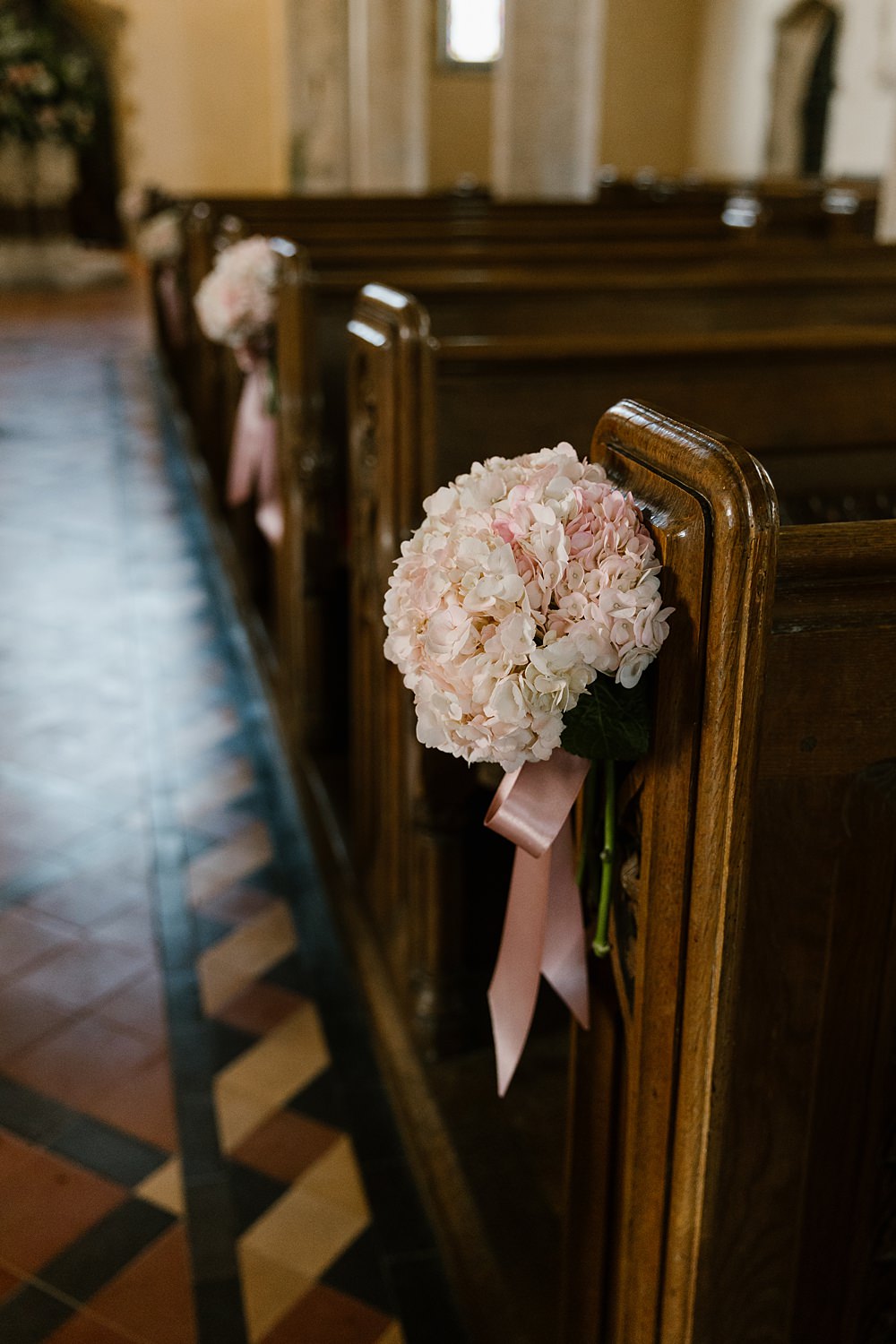Pew End Pink Cream Flowers Holkham Hall Wedding Katherine Ashdown Photography