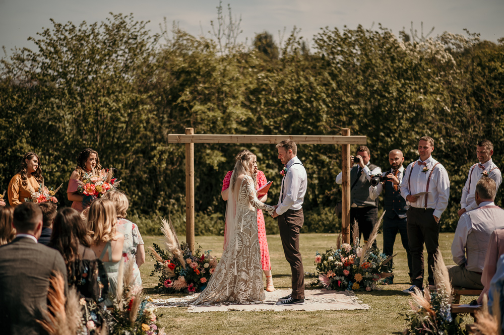 Ceremony Arch Backdrop Flowers Rug Decor Bohemian Tipi Wedding MattMoore Photography