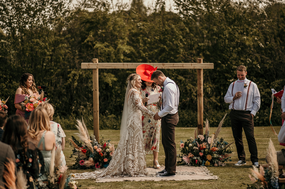 Ceremony Arch Backdrop Flowers Rug Decor Bohemian Tipi Wedding MattMoore Photography
