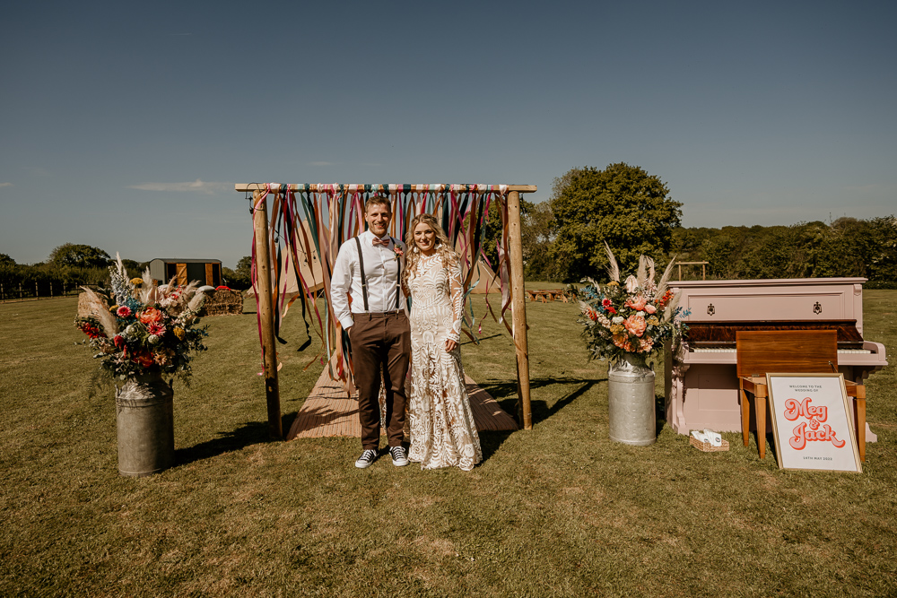 Ceremony Arch Backdrop Flowers Rug Decor Bohemian Tipi Wedding MattMoore Photography