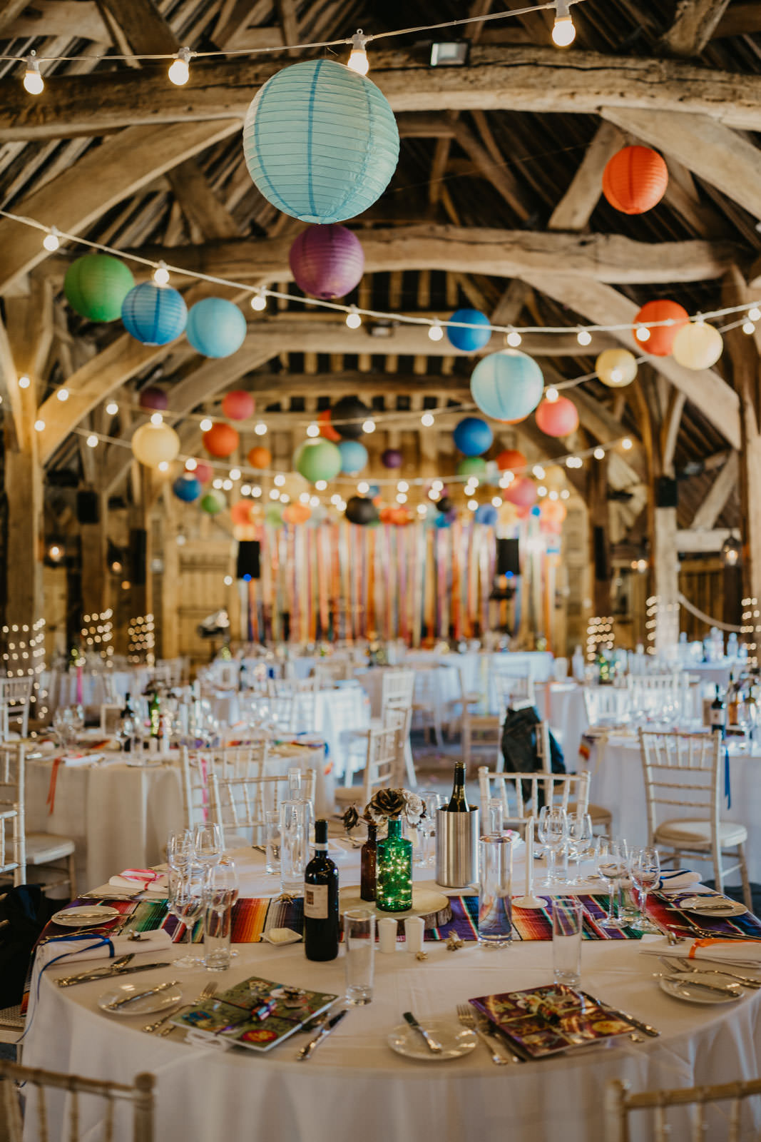 Colourful Paper Lanterns Festoon Lights Decor Ribbon Backdrop Streamer Bright Barn Wedding Kim Williams Weddings