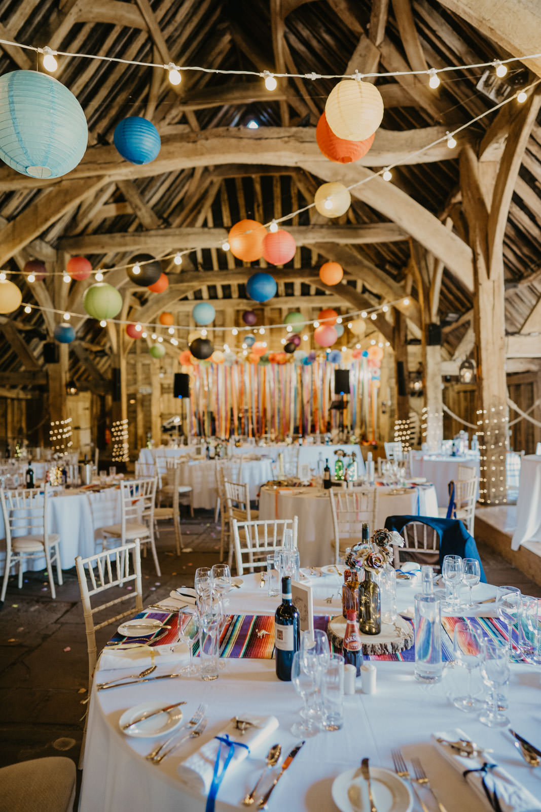 Colourful Paper Lanterns Festoon Lights Decor Ribbon Backdrop Streamer Bright Barn Wedding Kim Williams Weddings