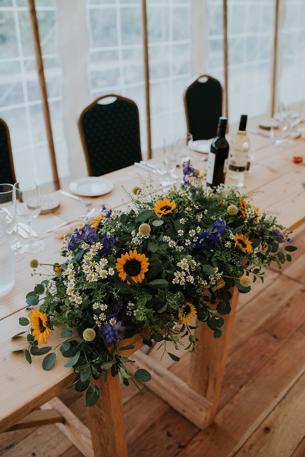 Top Table Flowes Blue Yellow Sunflowers Caerhyn Wedding Mary W Thomas Photography