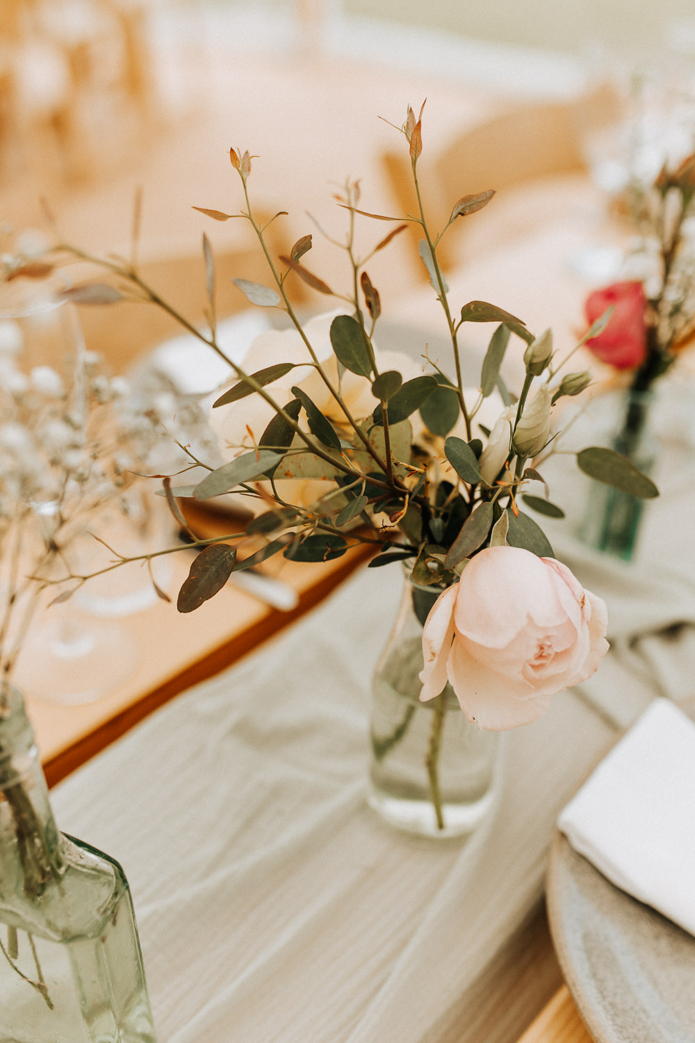 Centrepiece Table Flowers Bottles Elford Hall Garden Wedding Wyldbee