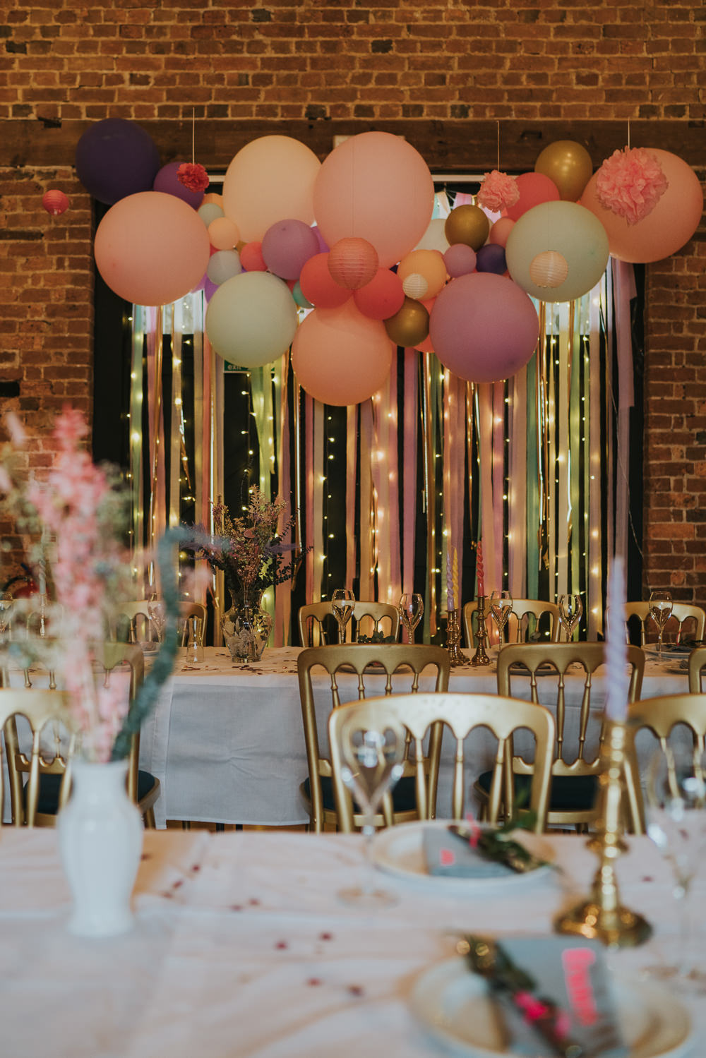 Pastel Balloon Ribbon Backdrop Top Table Barn Iridescent Wedding Dress Grace Elizabeth Photography