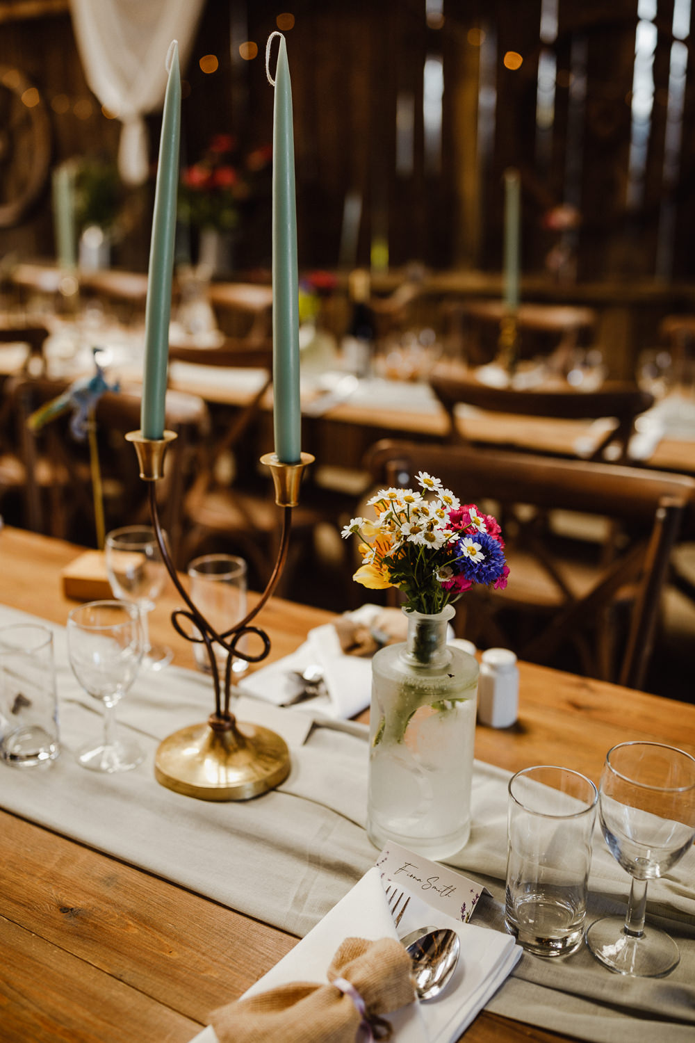 Jar Vase Flowers Centrepiece Table Cornflower Daisy Candles North Yorkshire Barn Wedding Photography34