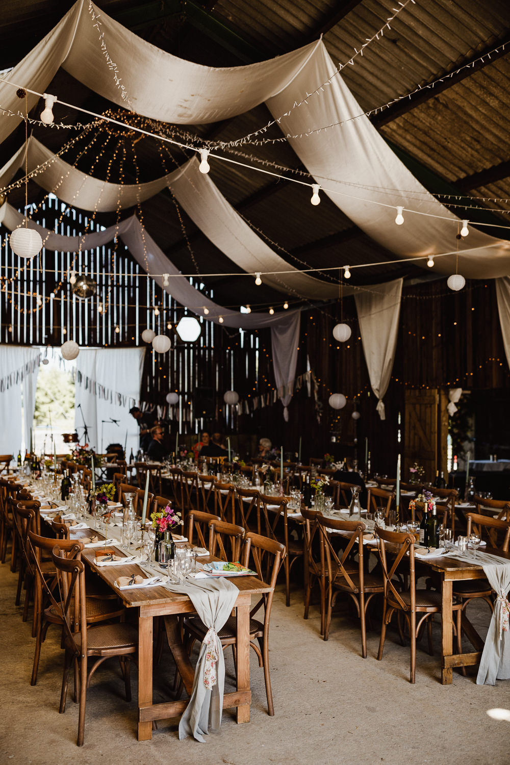 Drapes Festoon Lights Long Tables Reception Decor North Yorkshire Barn Wedding Photography34