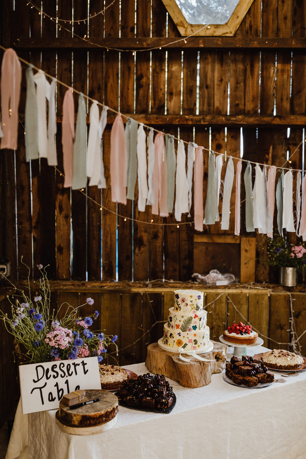 Dessert Table Cakes Rag Bunting Decor North Yorkshire Barn Wedding Photography34