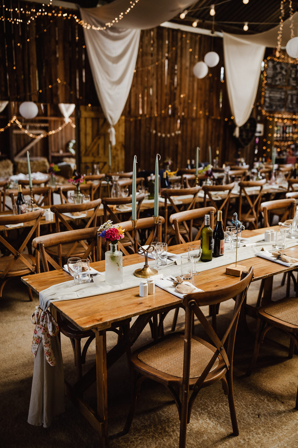 Drapes Festoon Lights Long Tables Reception Decor North Yorkshire Barn Wedding Photography34