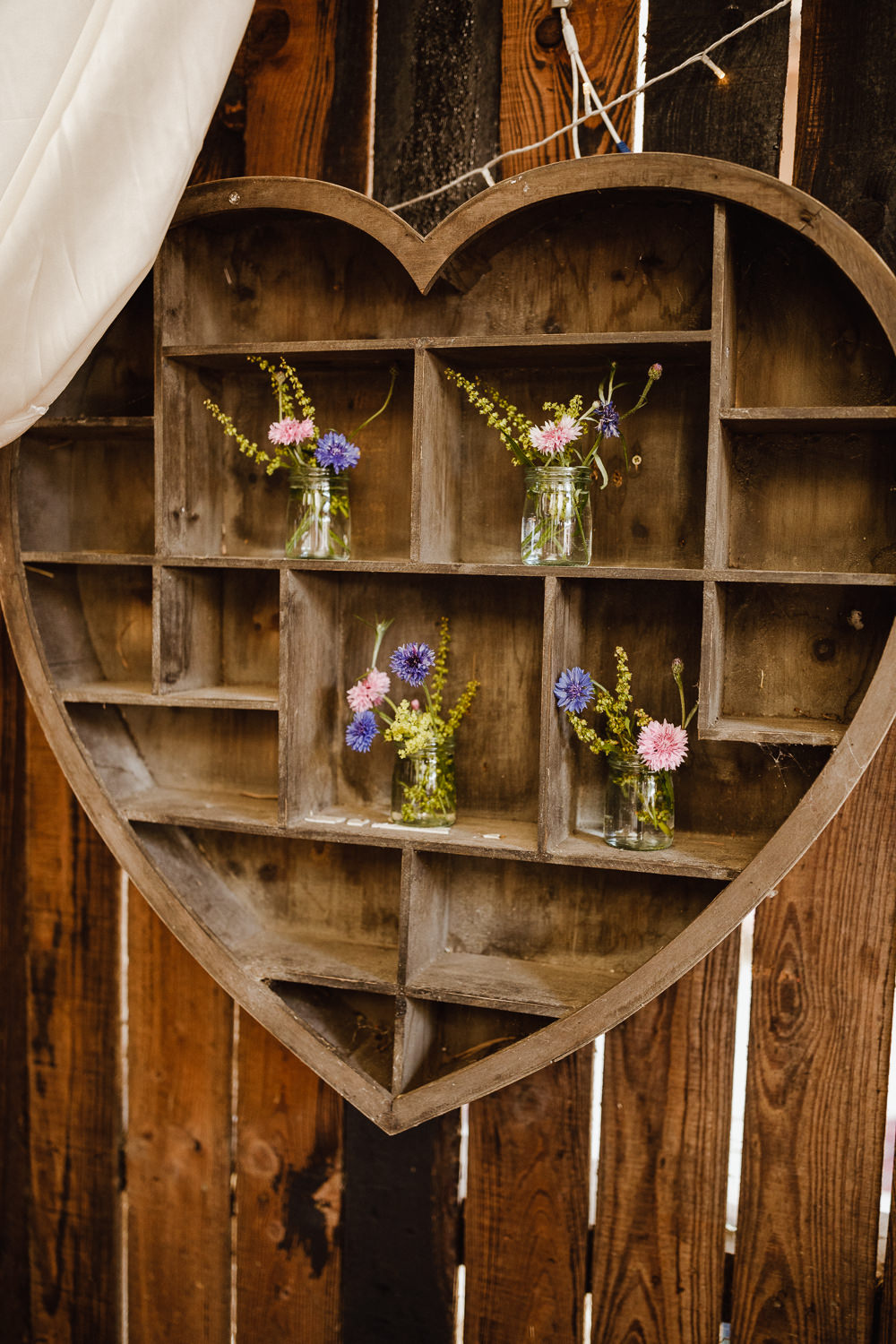 Flowers Bottles Heart Shelf North Yorkshire Barn Wedding Photography34